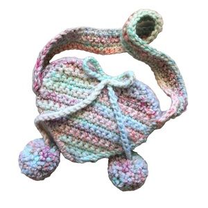 Crochet heart bag with pompon tassels